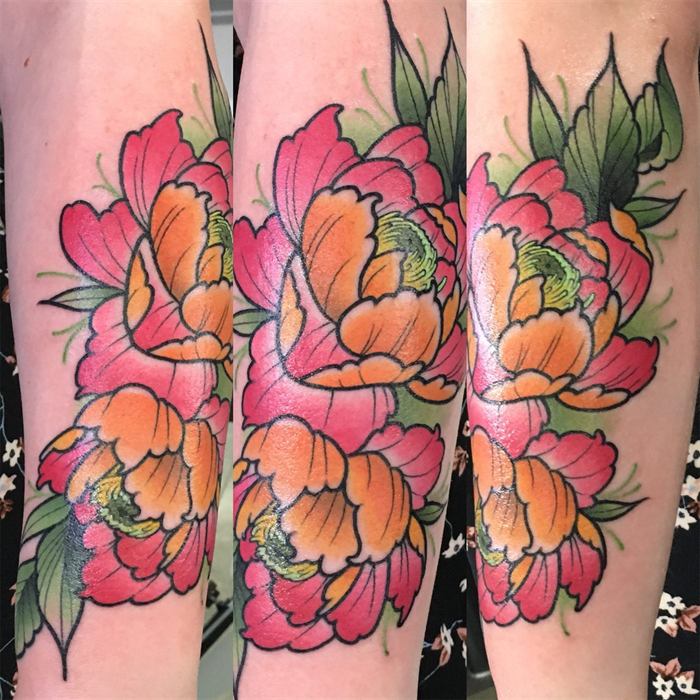 Pink and orange peonies wrapping the arm, shown from two sides