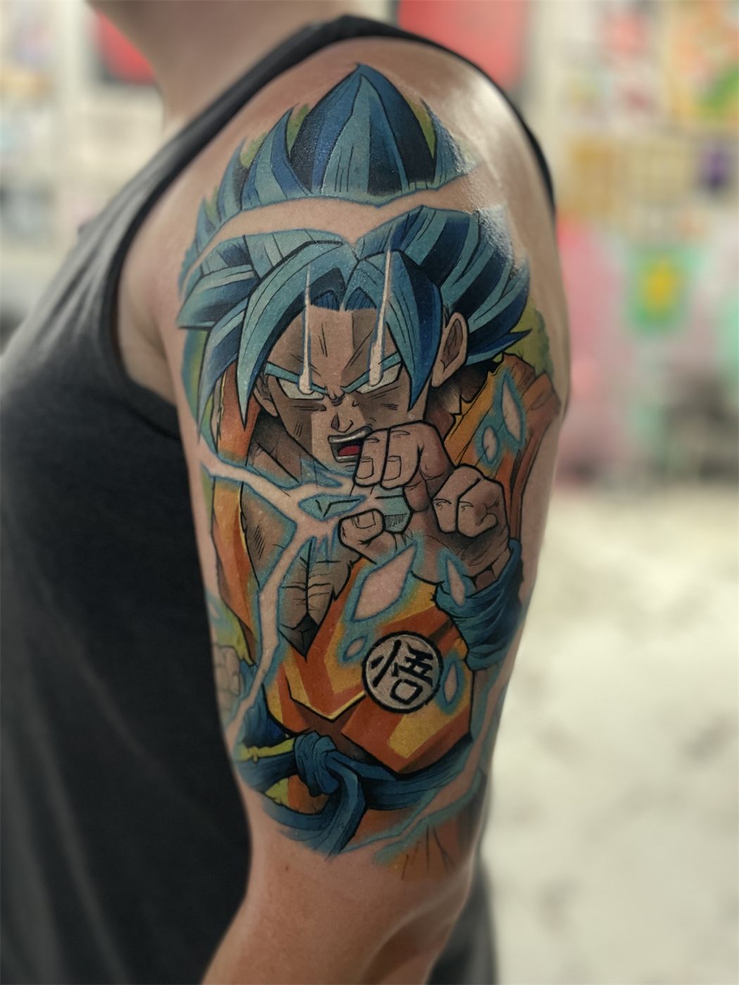 Anime fighter with an energy aura across the shoulder