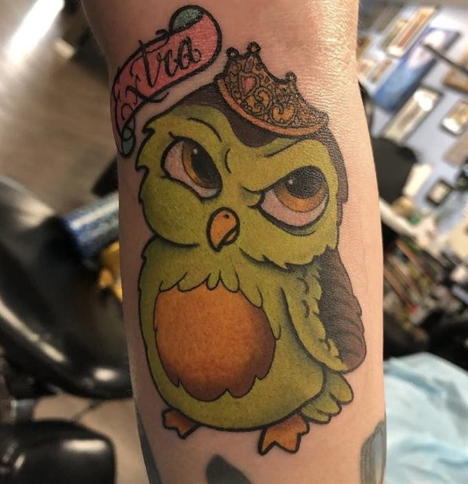 Crowned owl with a banner, traditional