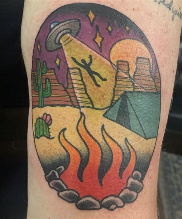 Desert landscape with pyramids and fire