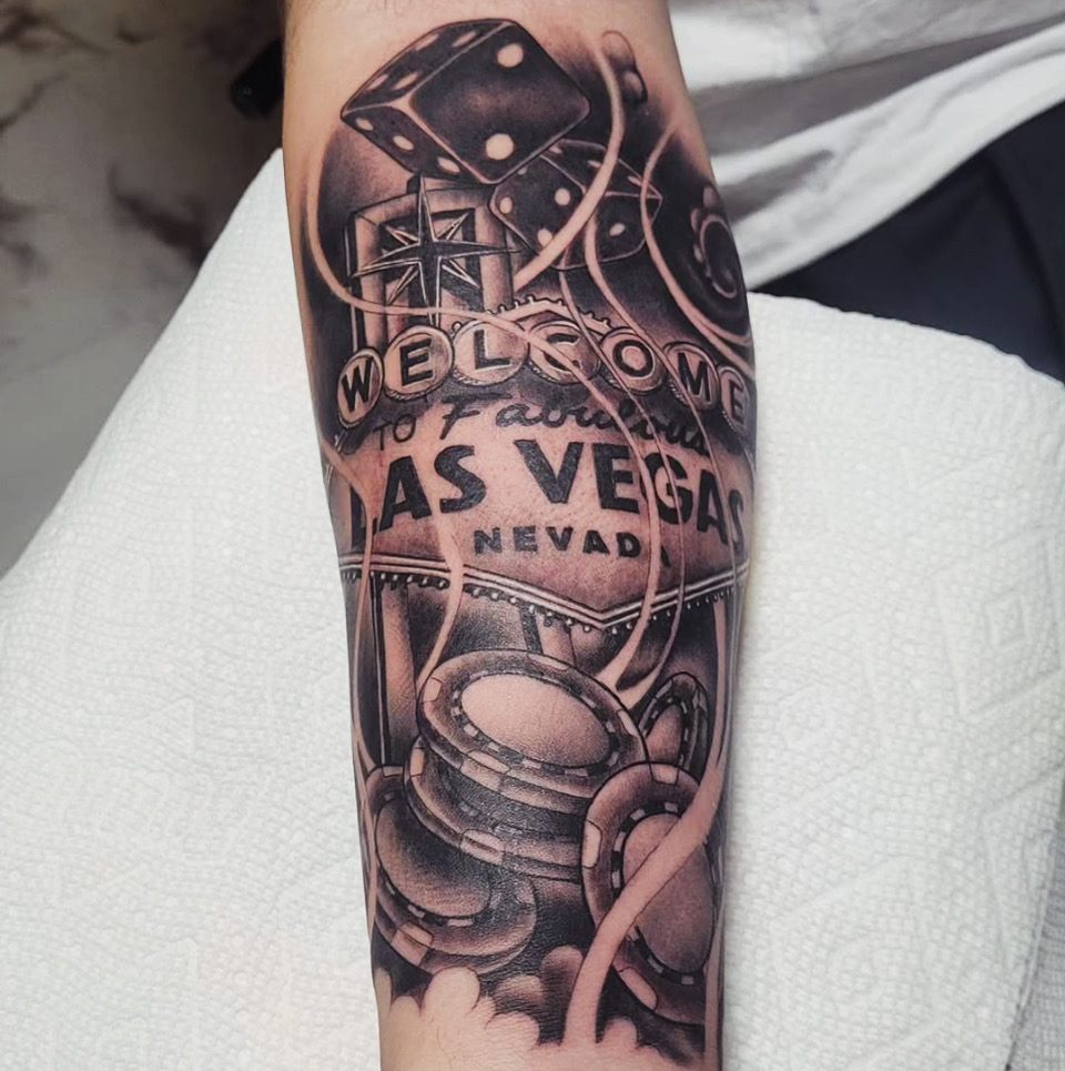 Welcome to Las Vegas sign, black and grey forearm