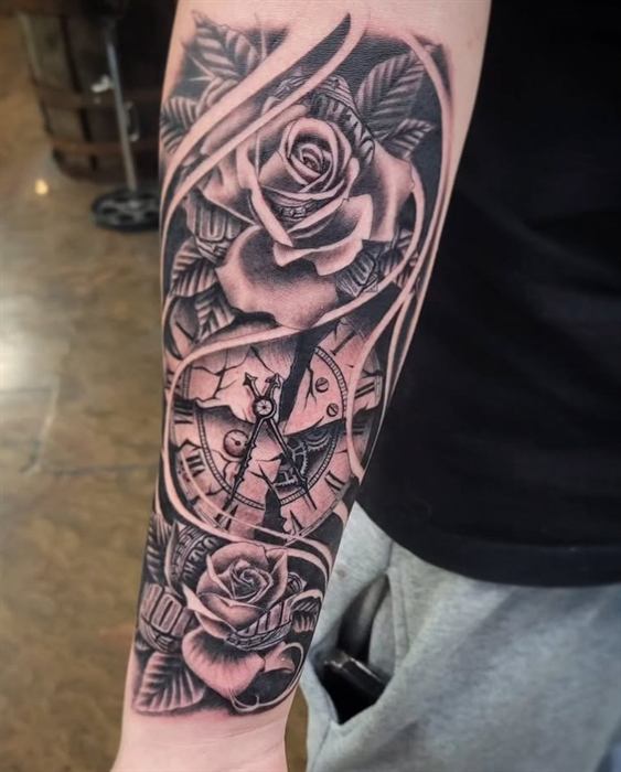 Rose and clock face, black and grey forearm